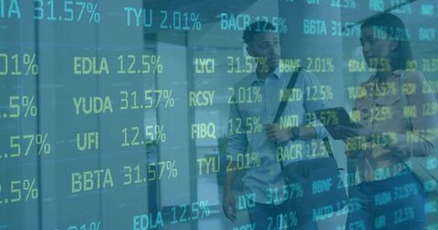 Business colleagues walking with tablet in modern office corridor with stock market ticker overlay