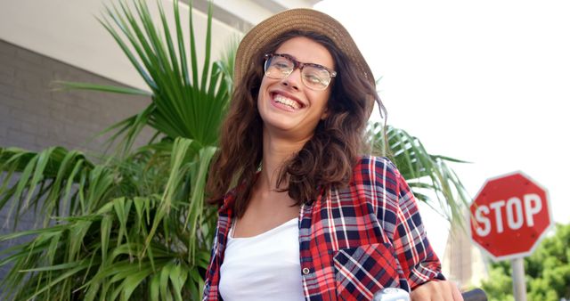 Joyful Young Woman with Hat Smiling Outdoors on Sunny Day - Download Free Stock Images Pikwizard.com