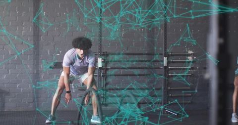 Athlete Resting in Gym with Digital Overlay for Intense Fitness Session