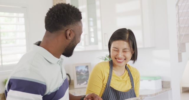 Multicultural Couple Happily Cooking Together in Modern Kitchen - Download Free Stock Images Pikwizard.com