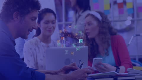 Diverse Coworkers Utilizing Technology in Modern Office Setting