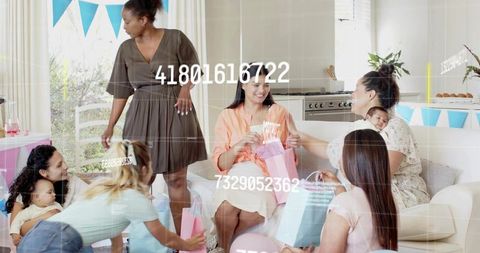 Friends celebrating baby shower with pastel gifts, balloons and cozy living room party