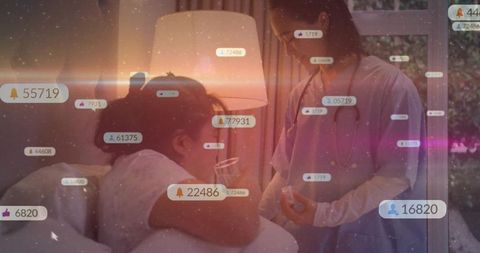 Healthcare provider assisting bedridden patient with digital alerts