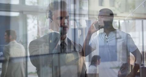 Stressed Businessman and Colleague in Office Building Dual Exposure