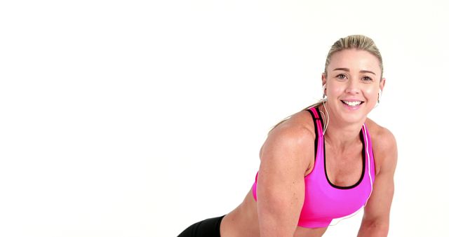 Smiling Athletic Woman in Pink Sports Bra Engaging in Workout - Download Free Stock Images Pikwizard.com