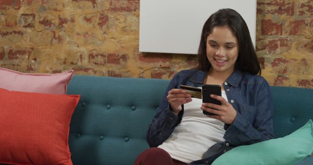 Young Woman Shopping Online with Credit Card on Comfortable Couch - Download Free Stock Images Pikwizard.com