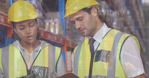 Warehouse Workers Analyzing Data with Overlapping Financial Graphics - Download Free Stock Images Pikwizard.com
