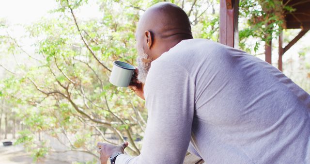 Senior Man Drinking Coffee While Enjoying Nature from Balcony - Download Free Stock Images Pikwizard.com