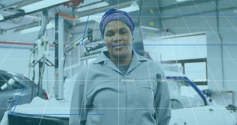 African Technician Analyzing Car Chassis in Industrial Workshop With Tech Overlay