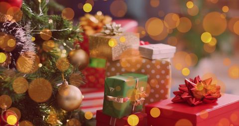 Festive Christmas Tree with Gift-Wrapped Presents and Golden Lights