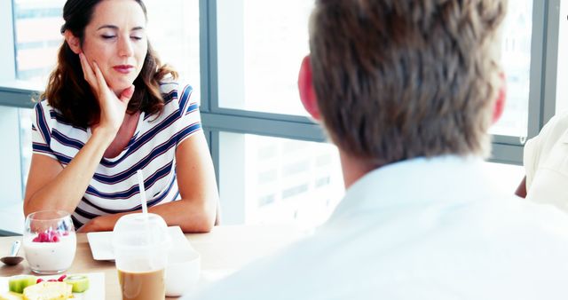 Woman Discussing with Colleague in Meeting Room - Download Free Stock Images Pikwizard.com