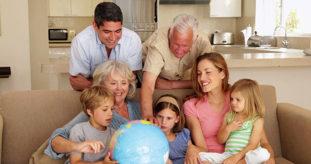 Happy Multigenerational Family Exploring Globe in Living Room - Download Free Stock Images Pikwizard.com