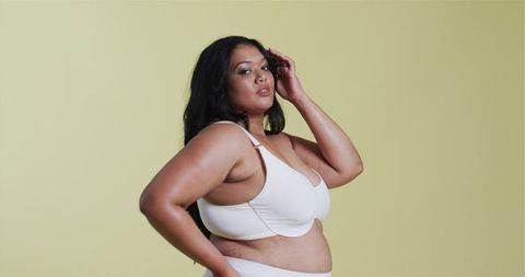 Confident Mid Adult Woman in White Lingerie Empowerment Pose