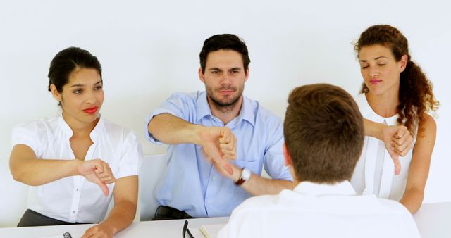 Team giving negative feedback to employee - Download Free Stock Images Pikwizard.com