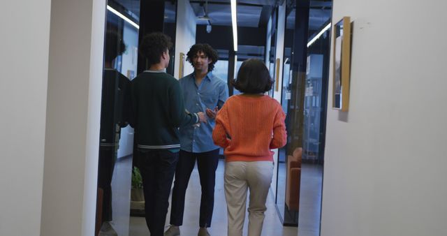 Colleagues Conversing in Modern Office Hallway - Download Free Stock Images Pikwizard.com