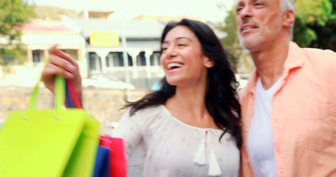 Happy Couple Shopping in Urban Environment
