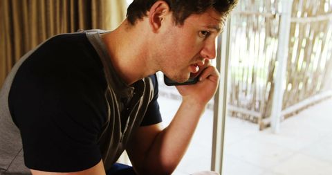 Man Speaking on Smartphone in Relaxed Home Environment - Download Free Stock Images Pikwizard.com