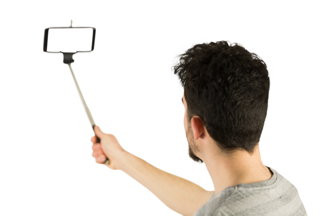 Casual man using transparent selfie stick technology in studio - Download Free Stock Videos Pikwizard.com