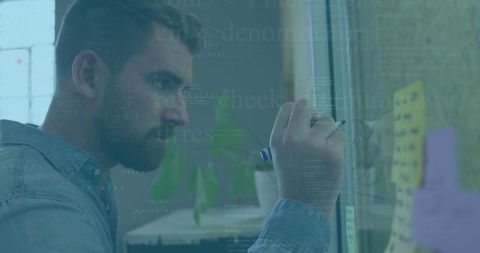 Man analyzing data tasks in modern office environment