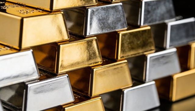 Gold and silver bullion bars stacking gleaming luxury precious metal investment