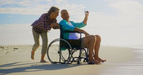 Senior Couple Enjoying Beach Moment Taking Selfie Together