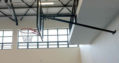 Basketball Hoop and Steel Arm in Gymnasium Interior