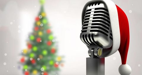 Retro Microphone Wearing Santa Hat Next to Blurred Christmas Tree - Download Free Stock Images Pikwizard.com