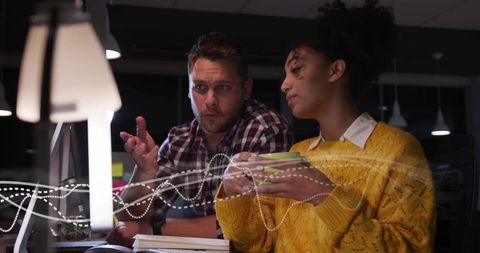 Late-Night Teamwork with Diverse Colleagues in Modern Office