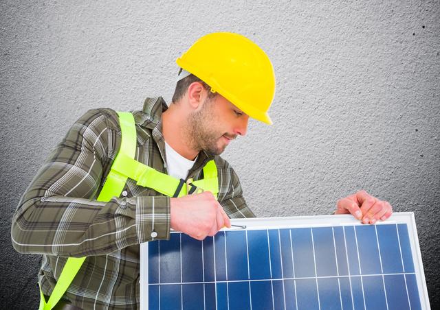 Digital composite image of man fixing solar panel