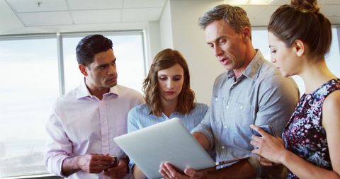 Dynamic Team Collaborating Over Modern Technology in Office - Download Free Stock Images Pikwizard.com