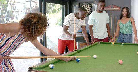 Friends Enjoying Indoor Pool Game Moments