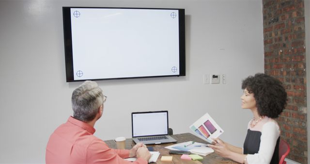 Professionals Discussing Color Samples in Modern Office Meeting - Download Free Stock Images Pikwizard.com