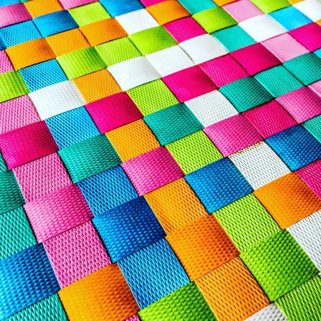 This colorful woven pattern features a variety of bright rainbow colors, creating an abstract and vibrant design. Suitable for use as a background, digital wallpaper, textile design reference, or artistic inspiration. Ideal for crafting projects, website design, or promotional materials requiring a splash of color and energy.