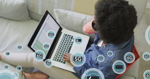 Woman Using Laptop with 6G Connectivity Concepts