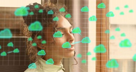 Contemplating woman reflecting with augmented reality cloud icons projected across window