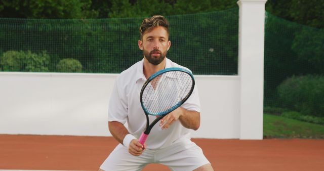 Focused Tennis Player Preparing to Return Shot on Tennis Court - Download Free Stock Images Pikwizard.com