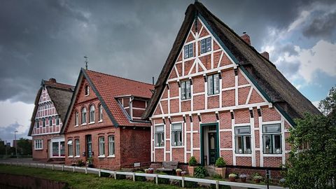 Traditional German Houses with Half-Timbered Design under Cloudy Sky