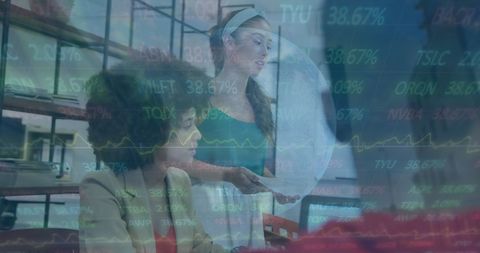 Multiracial Coworkers Analyzing Global Stock Market Trends in Office