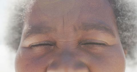 Close Up on Eyes of Joyful Senior African American Woman
