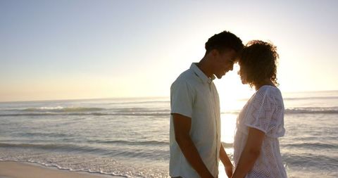 Romantic Biracial Couple at Sunset Beach Creating Cherished Connection - Download Free Stock Images Pikwizard.com