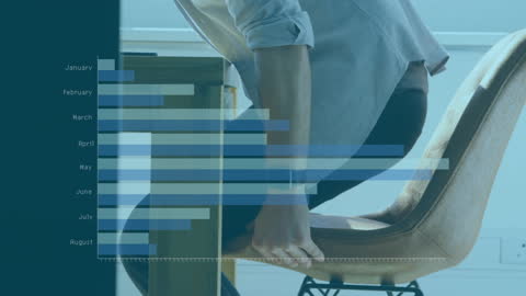 Man Analyzing Financial Growth with Overlaying Graphs