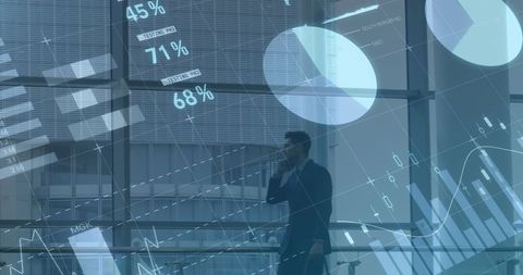 Businessman analyzing finance data holograms indoors