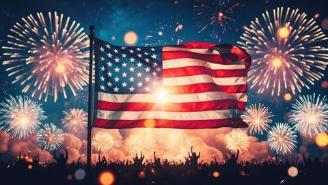 American flag waving amid festive fireworks celebration