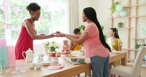 Joyful Women Socializing and Enjoying a Home Tea Party