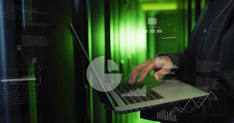 Korean technician typing on laptop in server room with analytics overlays and dashboards