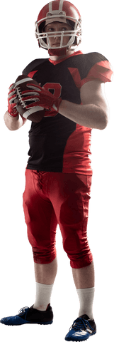 Focused american football player holding ball on transparent background