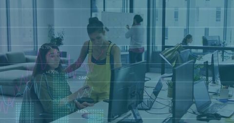 Team Collaboration in Open-Plan Office with Dual Monitors