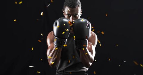 Powerful African American Boxer Amidst Celebratory Confetti
