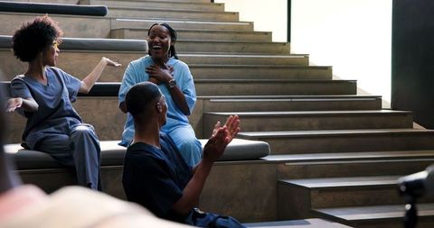 Medical professionals celebrating colleague's achievement