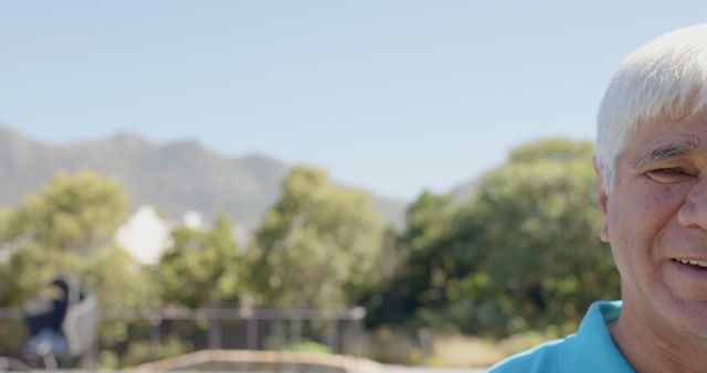 Senior Man Smiling Outdoors Against Mountainous Landscape - Download Free Stock Images Pikwizard.com